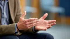 From a psychological perspective, what does frequent gesturing during conversation mean?